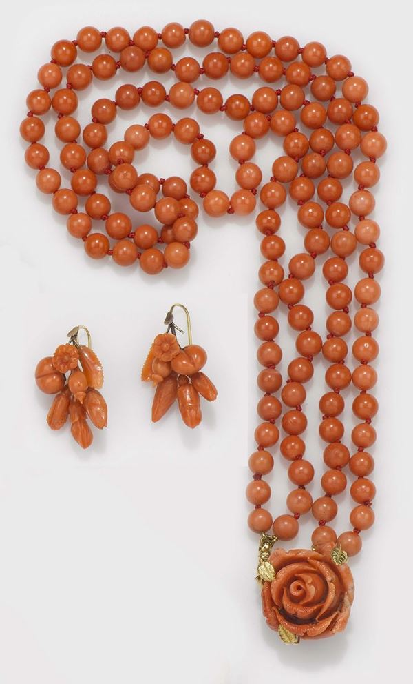 A lot of a two coral rows necklace and a pair of coral earrings