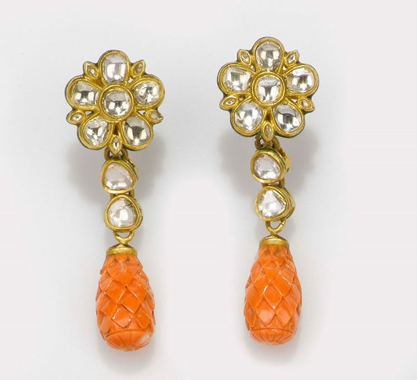 A pair of carved coral and enamel pendent earrings