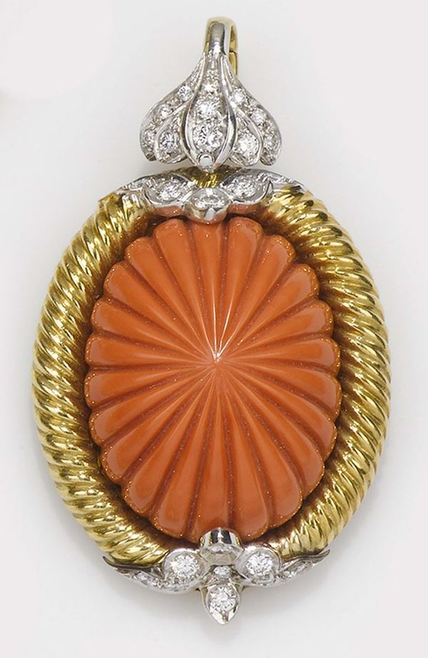 A carved coral, diamond and gold pendant