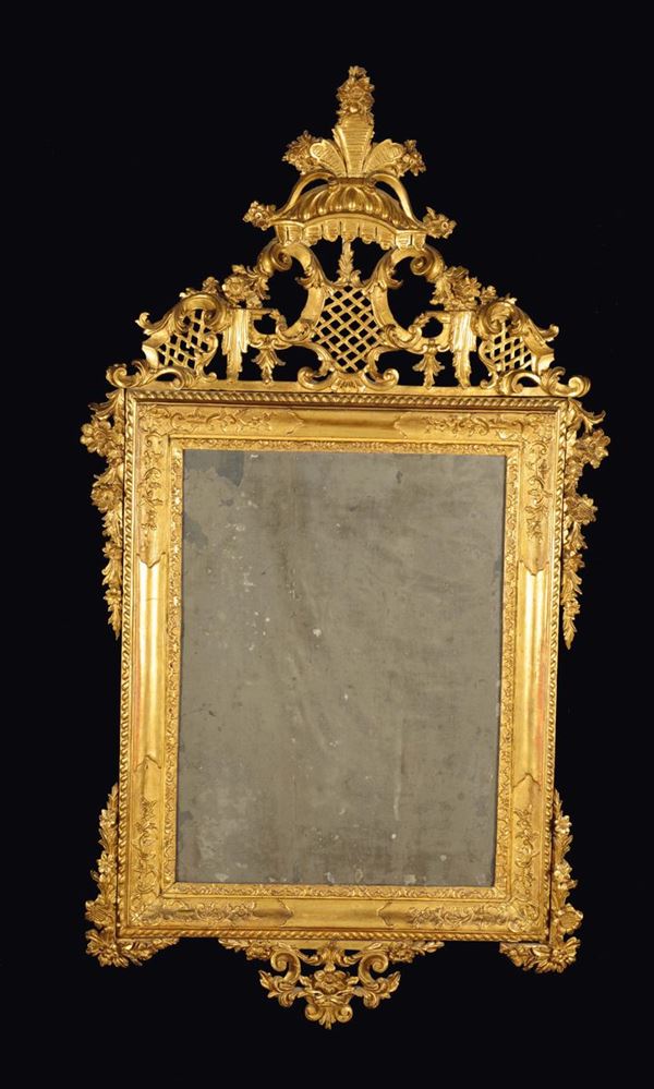 A carved and gilt wood mirror, Venetian style, Antonio Vernieri, Parma, early 18th century