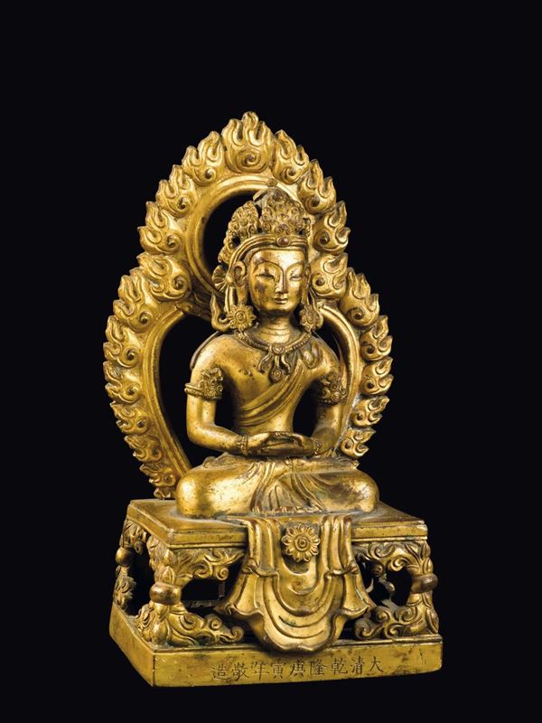 A gilt bronze figure of Amitayus with aura, China, Qing Dynasty, Qianlong Mark and Period (1736-1795)