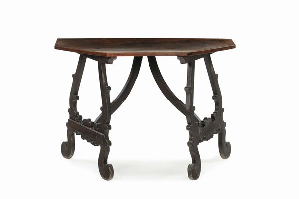 A semi-table with pentagonal walnut surface, central Italy, 17th-18th century