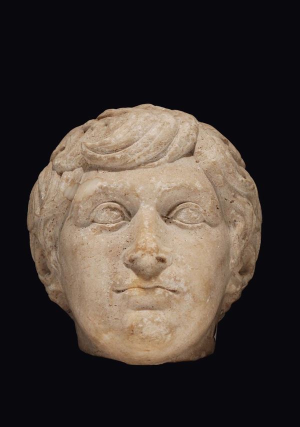 A marble young man’s head, 19th-20th century manufacture inspired to archaeological models