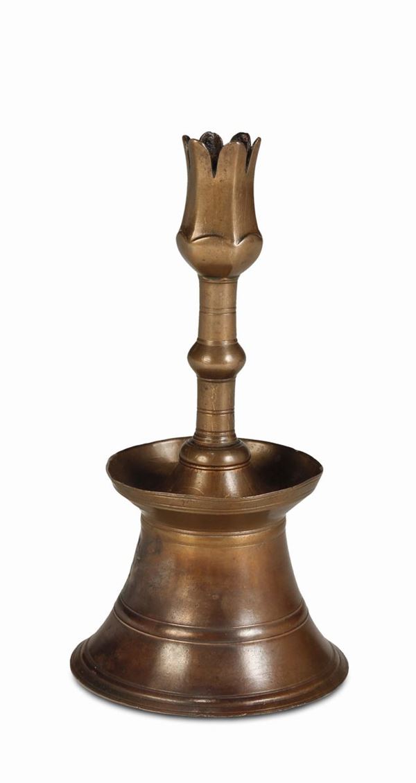 A molten, polished and inlaid bronze candlestick, Ottoman art, 17th century