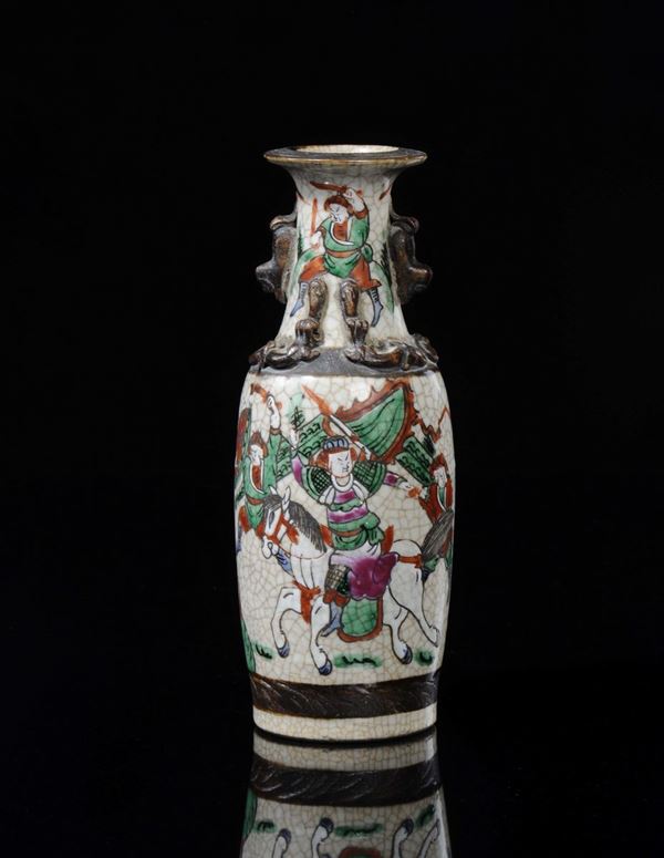 A craquelè polychrome enamelled porcelain vase with battle scene, China, Qing Dynasty, 19th century