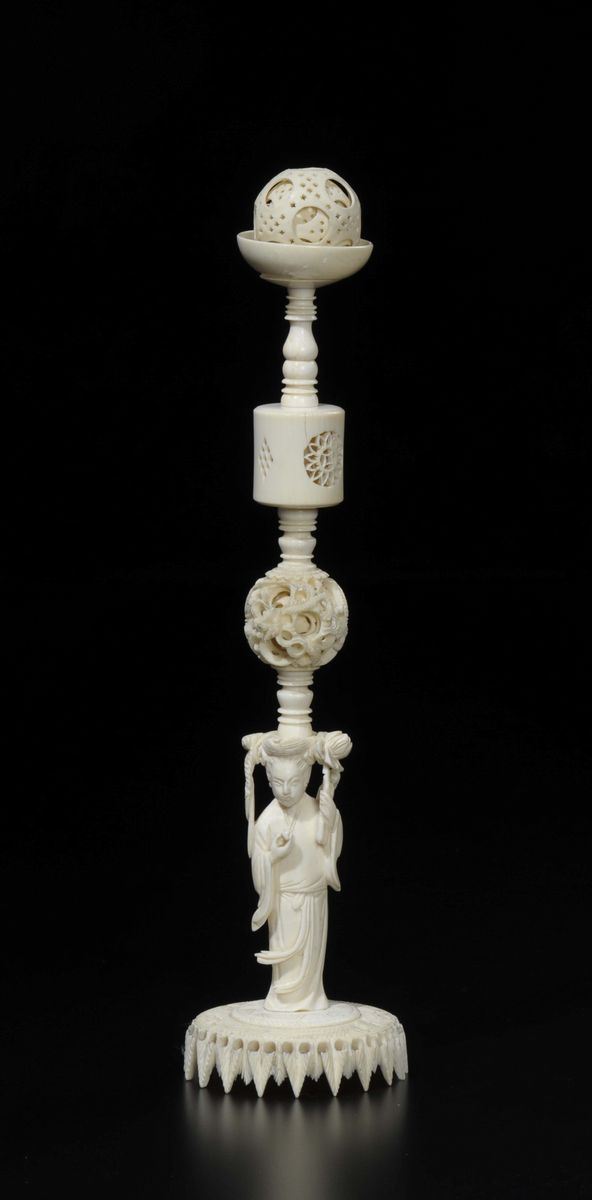A carved ivory Guanyin sustaining dragons spheres, China, early 20th century