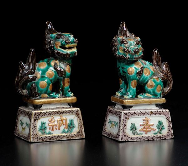 A pair of polychrome enamelled porcelain Pho dogs, Japan, 19th century