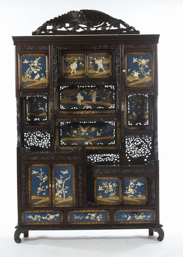 A large fretworked, carved and lacquered wooden furniture with naturalistic and common life scenes within reserves, Japan, early 20th century
