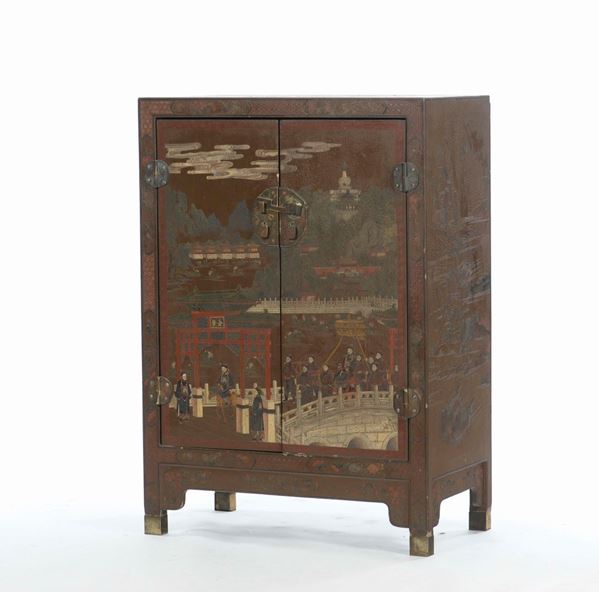 A lacquered wooden cabinet with two shutters depicting figures on a bridges, Japan, 19th century