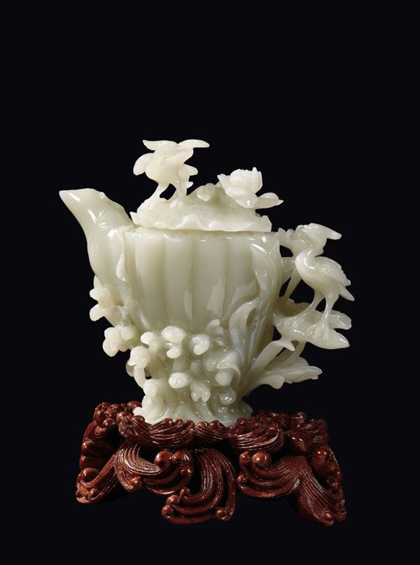 A white jade teapot and cover with cranes and flowers in relief, China, Republic, 20th century