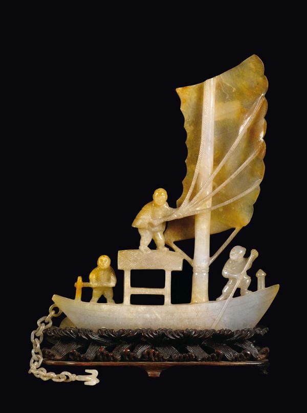 A white and russet jade ship with fishermen and an anchor China, Qing Dynasty, 19th century