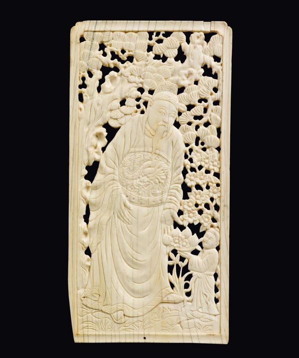 A fretworked ivory plaque with dignitary and child with basket of fruits, China, Ming Dynasty, 17th century