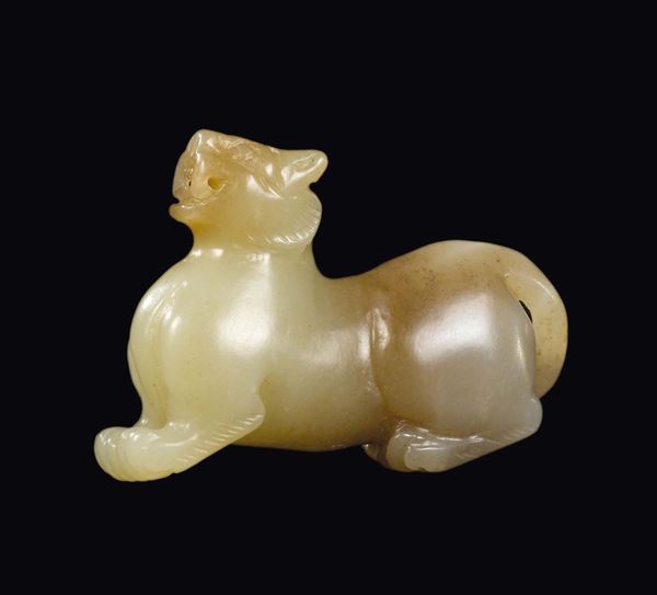 A small white and russet jade tiger, China, Qing Dynasty, 19th century