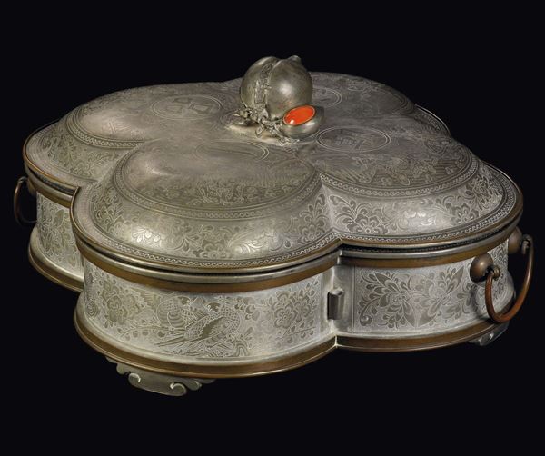 A pewter and copper quartefoil shaped food box and cover with inscriptions and figures and peach-handle, China, Qing Dynasty, late 19th century