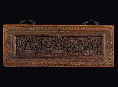 Pannello Scolpito in Legno con Raffigurazioni di Buddha e Divinità, Tibet, XVII Secolo