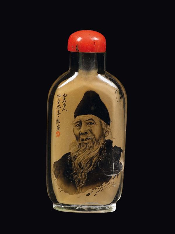 A rock crystal snuff bottle with a portrait of a man and an inscription, China, early 20th century