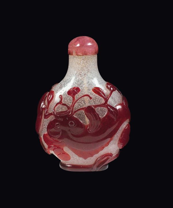 A glass snuff bottle with red fish in relief, China, Qing Dynasty, 19th century
