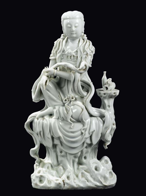 A Blanc de Chine Dehua porcelain Guanyin on a rock with ruyi, China, Qing Dynasty, Qianlong Period (1736-1795)