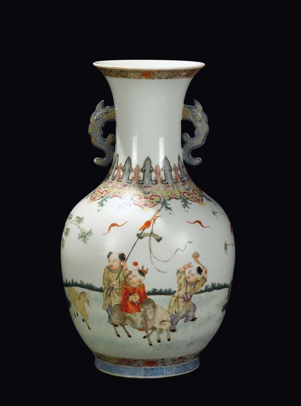 A polychrome enamelled double handled vase with playing children, China, Republic, 20th century
