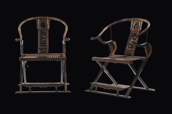 A pair of Jichimu wooden armchairs with fretworked seatbacks and footrest, China, Qing Dynasty, 18th century
