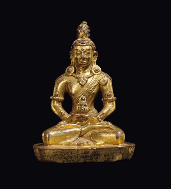 A gilt bronze figure of Shakyamuni with censer, China, Qing Dynasty, 18th century
