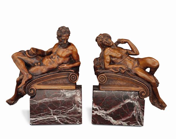 A pair of bronze figures on coloured marble bases representing the Sunset and the Sunrise, Italian manufacture, 19th-20th century