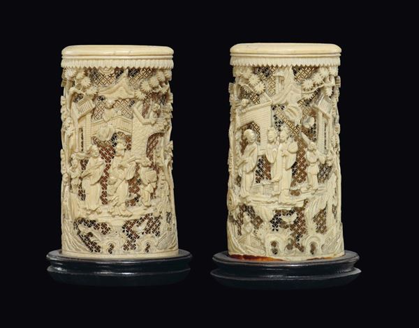 A pair of fretworked ivory brushpots with common life scenes decoration, China, early 20th century