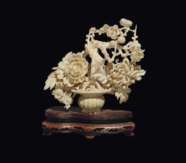 A small carved ivory basket of roses, China, early 20th century