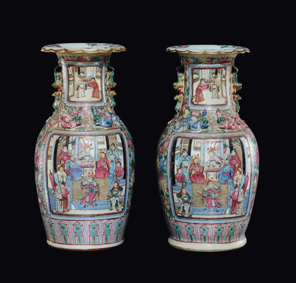 A pair of Famille-Rose vases with court life scenes within reserves and small dragons in relief, China, Qing Dynasty, 19th century