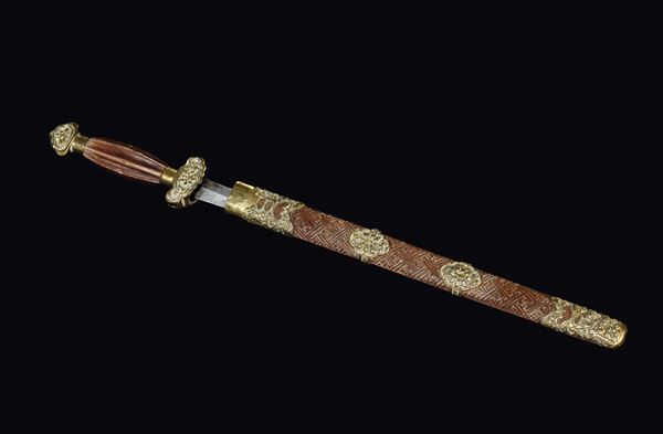 A dagger with wodden and gilt copper handle and lining, Tibet, 18th century