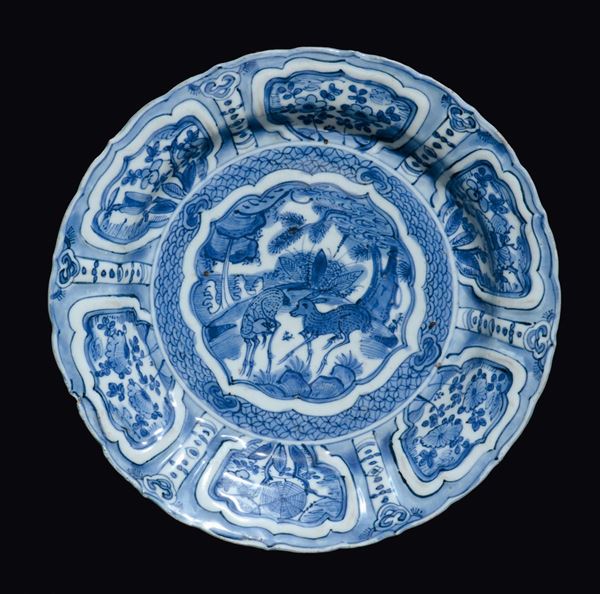 A blue and white dish with deers and naturalistic decoration within reserves, China, Ming Dynasty, Wanli Period (1573-1619)