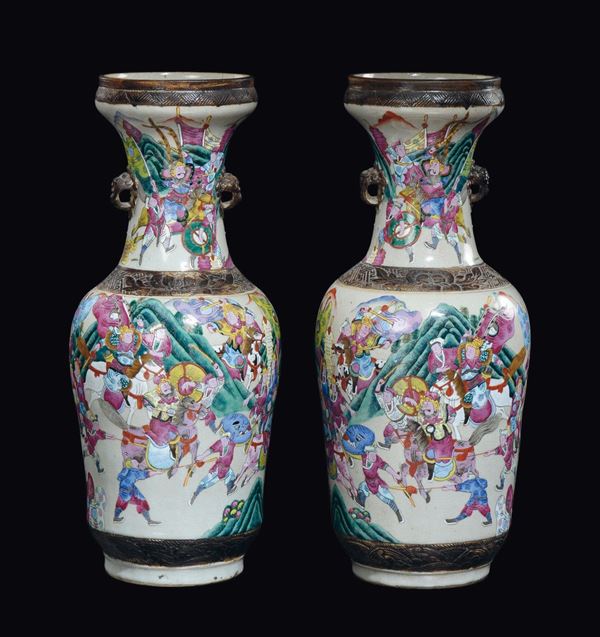 A pair of craquele porcelain vases with battle scenes and elephant heads-handles, China, Qing Dynasty, 19th century