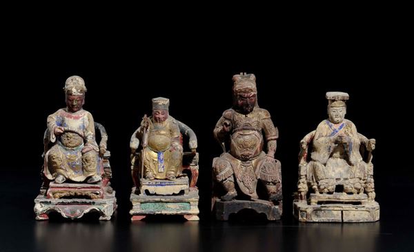 Four carved wood sitting dignitaries, China, Qing Dynasty, 19th century