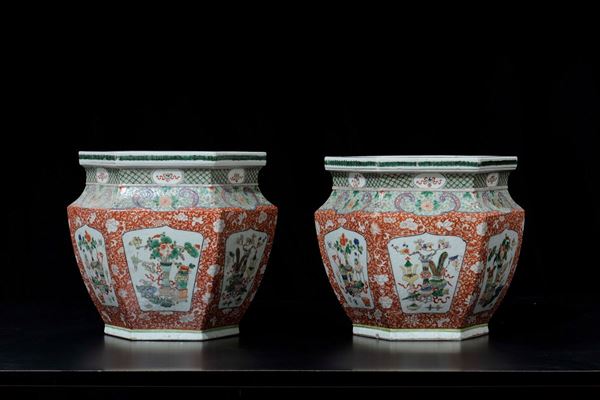 A pair of Famille-Verte hexagonal based cachepot with vases within reserves, China, Qing Dynasty, 19th century