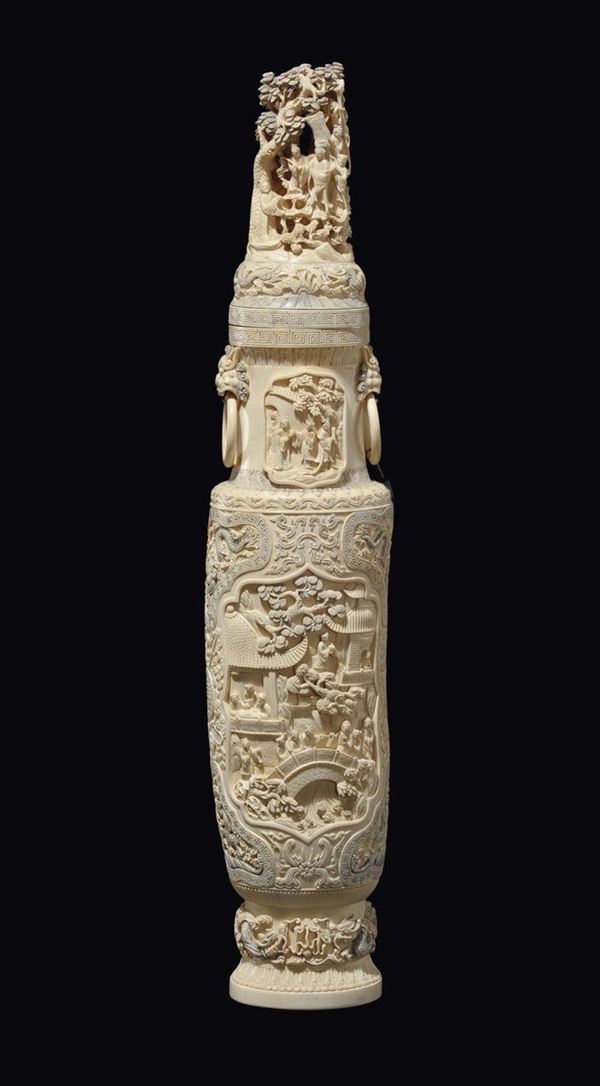 An ivory vase and cover with rings-handles carved with common life scenes, China, Qing Dynasty, 19th century