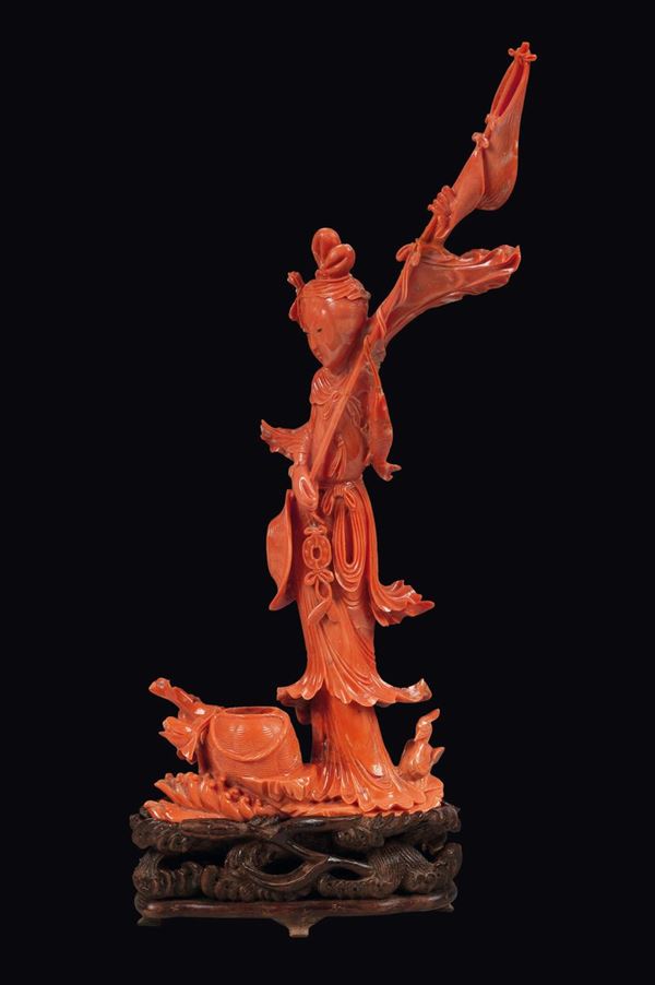 A carved coral Guanyin with standrad and a wicker basket group, China, early 20th century