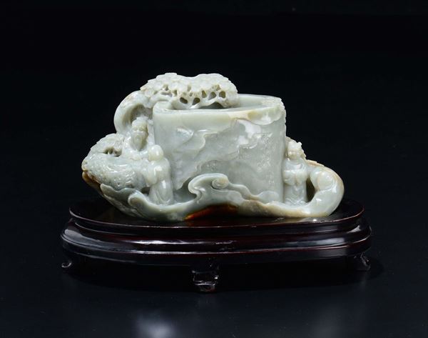 A Celadon jade brush bowl with figures and trees in relief, China, 20th century