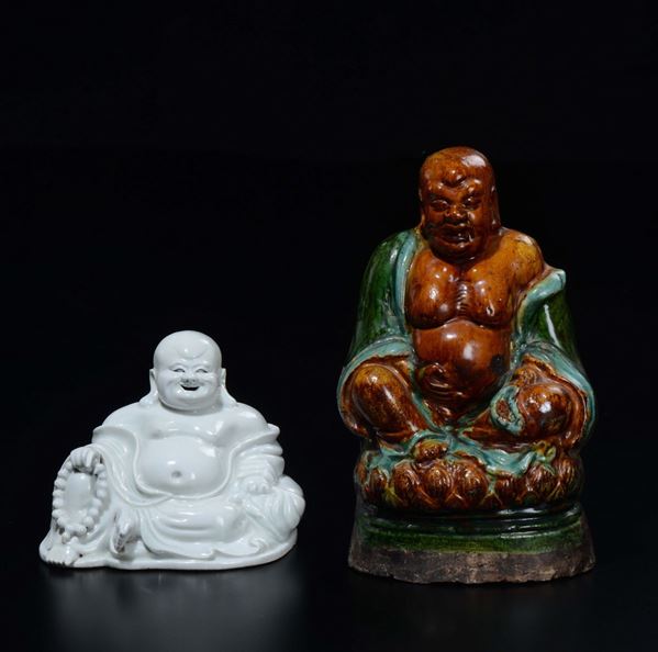 Lot of one Blanc de Chine figure of Budai and one polychrome enamelled Budai on lotus flower, China, Qing Dynasty, early 19th century