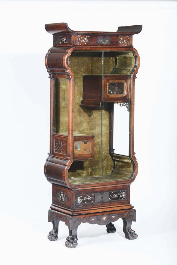 A carved wood showcase with glass shutters, China, 20th century