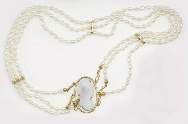 A seed pearl necklace with cameo on clasp