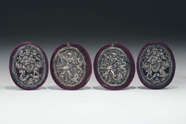 Gruppo di quattro placchette da confraternita in argento sbalzato e cesellato. Genova (?) XVIII secolo