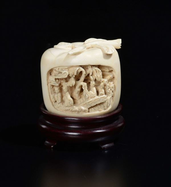A carved ivory apple with dignitaries in relief, China, ealry 20th century
