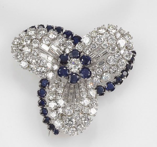 A diamond and sapphire brooch. Mounted in platinum