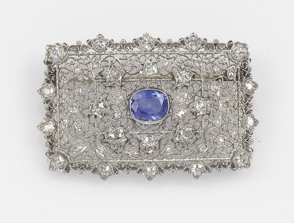 A sapphire brooch. Mounted in platinum
