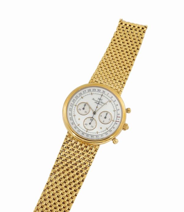 IWC,International Watch Co., Schaffhausen, orologio da polso, cronografo, al quarzo, in oro giallo 18K, con bracciale in oro 18K IWC.