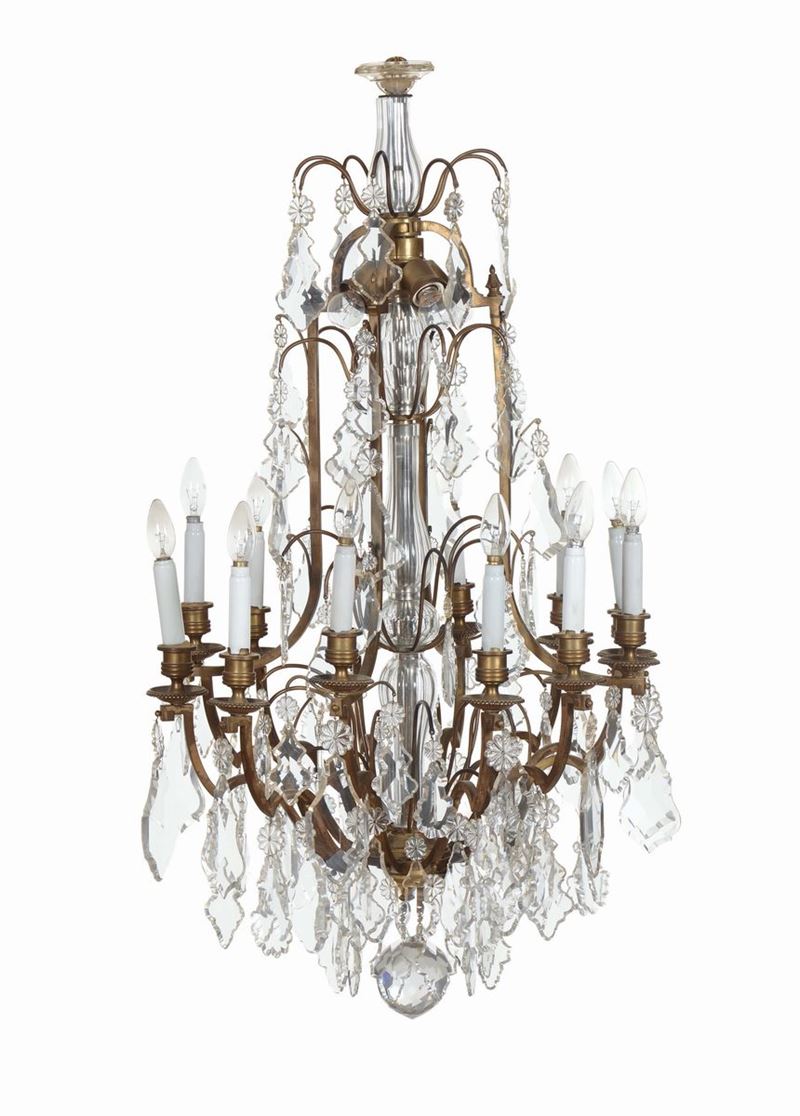 Lampadario in bronzo e cristallo a sedici luci, XX secolo  - Auction Furnishings from the mansions of the Ercole Marelli heirs and other property - Cambi Casa d'Aste
