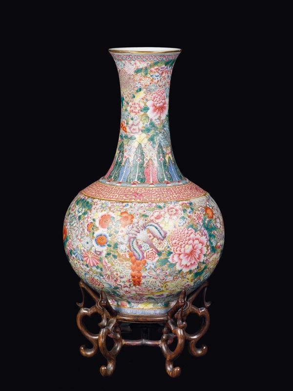 A polychrome enamelled milleflor-ground porcelain bottle vase, China, Qing Dynasty, early 20th century