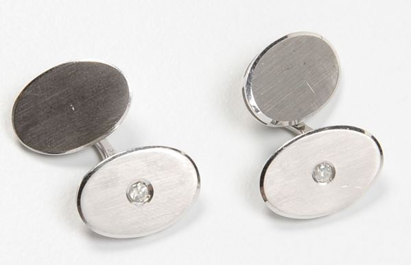 A pair of gold and diamond cufflinks