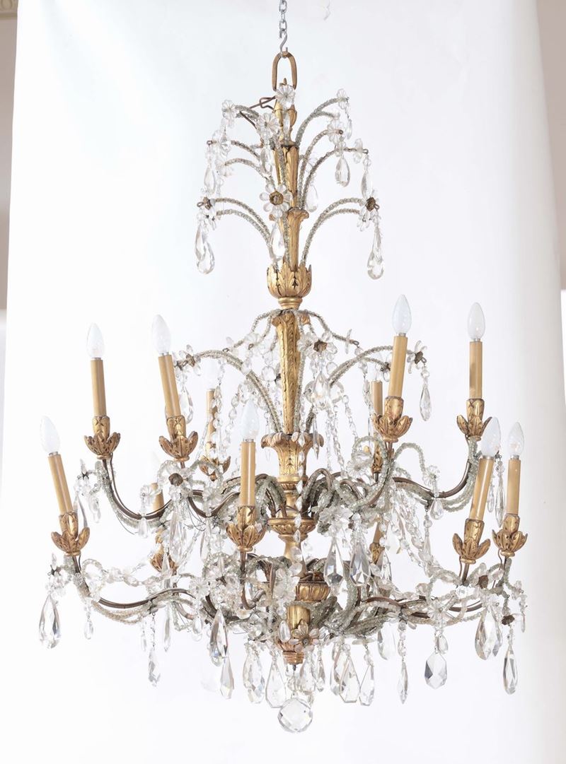 Lampadario in legno intagliato e dorato a dodici luci  - Asta Arredi dalle dimore degli eredi Ercole Marelli e altre provenienze - Cambi Casa d'Aste