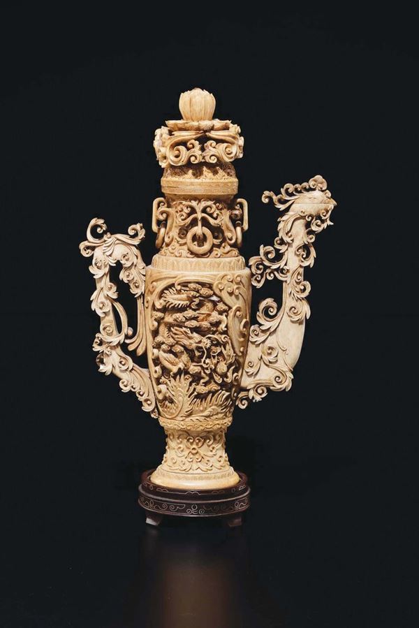 A carved ivory vase and cover with lotus flower and phoenix-handle, China, early 20th century